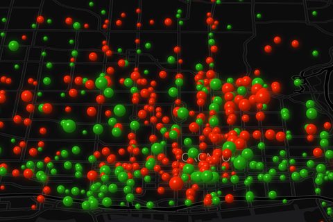 Red and green spheres over a dark map of downtown Toronto